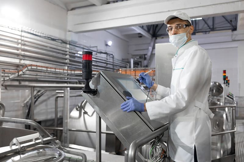 technologist-make-set-up-production-line-while-standing-near-digital-screen-department-dairy-factory (1).jpg
